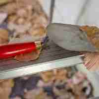 Use a Putty Knife for removing debris from countertop