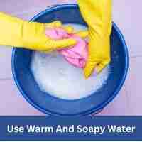 Use warm and soapy water